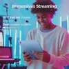 A young person is holding a light blue tablet in a room with colorful lighting. Produktbild-Vorschau
