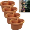 Four brown planters are stacked on a white background, with a small inset image showing the planters mounted on a brick wall with flowers. Podgląd zdjęcia produktu