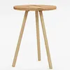 A small, round wooden table with three legs, photographed against a white background. Produktbild-Vorschau