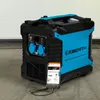 A portable inverter generator is shown in a garage or workshop setting, with a smartphone connected to it, displaying an online store interface. Anteprima dell’immagine prodotto