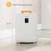 A white cylindrical appliance with a wooden handle and a digital display, placed on a tiled floor. Anteprima dell’immagine prodotto