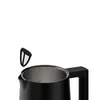 A close-up view of the top of a black electric kettle, with a filter being held above the opening. Podgląd zdjęcia produktu