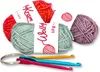 A collection of yarn balls and crochet hooks. Produktbild-Vorschau