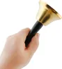 A hand holding a brass bell with a black handle. Náhled obrázku produktu
