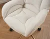 Close-up of a white teddy fabric office chair with gold legs and black wheels. Produktbild-Vorschau