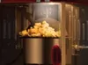 Close-up of popcorn being made in a vintage-style popcorn machine. Náhled obrázku produktu