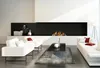 A modern living room with a fireplace, sofas, and a coffee table. Produktbild-Vorschau