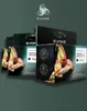 Several boxes of ink cartridges are displayed in a staggered arrangement against a dark green background. The boxes feature images of chameleons and branding. Produktbild-Vorschau