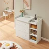 A white changing table with drawers and shelves in a child's room. Podgląd zdjęcia produktu
