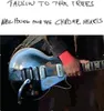 A close-up shot of a person playing a guitar, with text at the top of the image. Produktbild-Vorschau