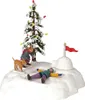 A miniature Christmas village scene with a decorated tree, an igloo, and figures playing in the snow. Podgląd zdjęcia produktu