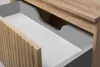 A close-up view of an open drawer in a wooden cabinet, showing the interior. Anteprima dell’immagine prodotto