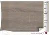 A close-up of a wood-patterned adhesive film with a ruler marking its dimensions. Produktbild-Vorschau