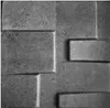A close-up view of textured gray wall panels with a brick-like pattern. Náhled obrázku produktu