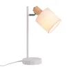 A white desk lamp with a fabric shade and a wooden accent is shown against a white background. Produktbild-Vorschau