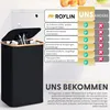 A black laundry hamper with a wooden rim is shown, filled with plastic bottles. A comparison chart is displayed next to it. Produktbild-Vorschau