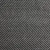 A close-up view of a grey herringbone patterned fabric. Anteprima dell’immagine prodotto