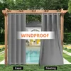 Outdoor curtains hanging on a wooden pergola in a garden setting with a swimming pool and patio furniture visible in the background. Produktbild-Vorschau