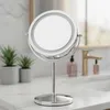 A makeup mirror on a bathroom counter. Produktbild-Vorschau