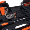 A close-up view of a tool kit, showing various tools like pliers, screwdrivers, and hex keys organized within a black case with orange accents. Produktbild-Vorschau