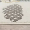 A close-up view of a rug with a pattern of gray clouds with white polka dots on a white background. Produktbild-Vorschau