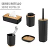A collection of bathroom accessories, including a tissue box, soap dispenser, toothbrush holder, soap dish, and toilet brush, all with a black ribbed design and wooden accents. Náhled obrázku produktu