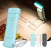 A collage of images showing a portable LED book light in different colors, a close-up of the light, and a light attached to a book. Produktbild-Vorschau