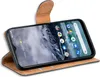 A smartphone in a brown flip case, angled to show the screen and case. Produktbild-Vorschau