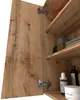 A close-up view of an open wooden cabinet with shelves and toiletries. Produktbild-Vorschau