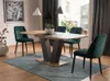 A dining room scene with a table and chairs. Produktbild-Vorschau