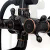 A close-up view of a black retro-style shower faucet with bronze accents. Náhľad obrázku produktu