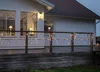 A house deck at dusk decorated with icicle-shaped LED string lights. Podgląd zdjęcia produktu