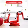 A red apple peeler is shown in a kitchen setting with cabinets in the background. Produktbild-Vorschau