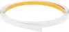 A roll of white trim with a yellow adhesive backing is shown against a white background. Podgląd zdjęcia produktu