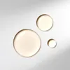 Three droplets of serum on a white background with soft lighting. Produktbild-Vorschau