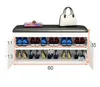 A white shoe cabinet with a black upholstered bench top, displaying shoes and a handbag. Anteprima dell’immagine prodotto