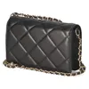 A black quilted handbag with a gold chain strap is shown against a white background. Produktbild-Vorschau
