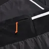 Detailansicht der Aenergy TR 2 in 1 Shorts von Mammut; zeigt die schwarze Stoffstruktur und eine orangefarbene Zugkordel. Produktbild-Vorschau