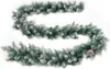 A green Christmas garland with pinecones and artificial snow, laid out in a curve on a white background. Produktbild-Vorschau