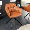 A brown leather swivel chair with a black metal base in a modern dining room setting. Produktbild-Vorschau
