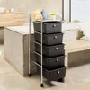 A bathroom setting with a bathtub, vanity, and a rolling storage cart. Produktbild-Vorschau