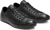 A pair of black leather Converse Chuck Taylor low-top sneakers. Náhled obrázku produktu