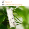 A close-up of a plant tag with water droplets on it, surrounded by green leaves. Produktbild-Vorschau