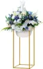 A floral arrangement in a white bowl on a gold stand. Produktbild-Vorschau