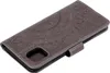 A gray flip case for a smartphone with a mandala pattern embossed on the cover. Produktbild-Vorschau