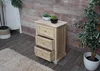 A wooden chest of drawers with rattan inserts is placed on a wooden floor next to a potted plant. A rug is in the foreground. Podgląd zdjęcia produktu