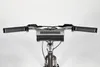 A close-up view of a bicycle's handlebars with a digital radio attached. Produktbild-Vorschau