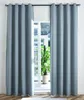 Two blue curtains are drawn back to reveal a window with a potted plant and a building visible outside. Produktbild-Vorschau