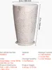 A tall, textured planter with a saucer, shown with dimensions and product details. Voir les images du produit