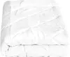 A folded white comforter is shown against a white background.